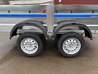 Прицеп Кремень стандарт плюс двухосный 3,0*1,56А см с бортом 50 с тентом 100 см